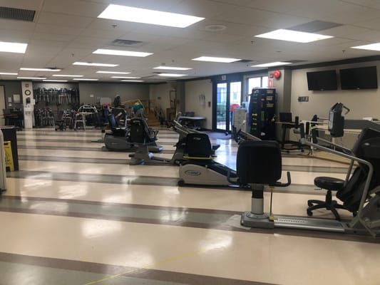 Exercise equipment in the gym area of Brookhaven Health Care Facility