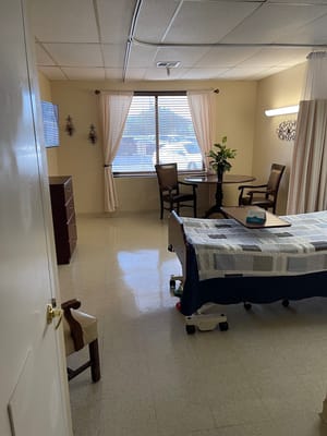 Interior view of a resident room with a table and chairs