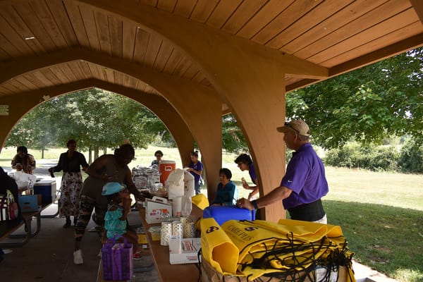 Residents and staff interacting at an outdoor event