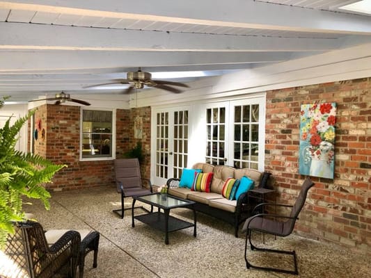 Covered seating area with colorful cushions