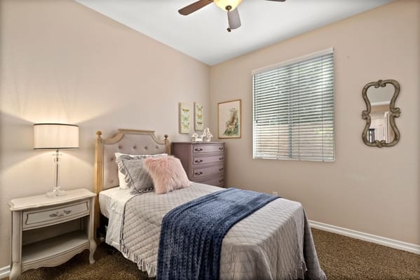 Cozy resident room with a bed and decor