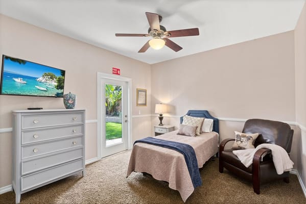 Cozy bedroom with a view of an outdoor space