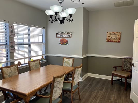 Dining area with a large table and decor