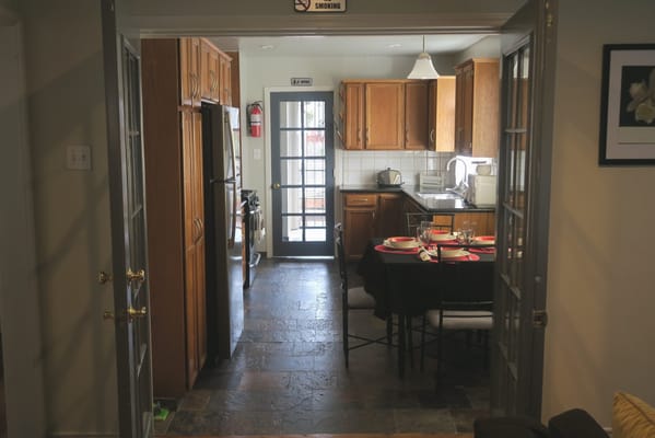 Bright dining area with wooden furniture and table settings