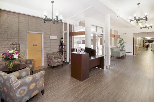 Bright and inviting lobby area with seating and reception desk