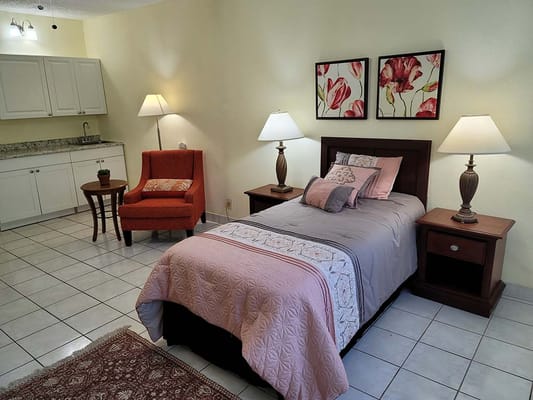 Cozy resident room with bed and seating area