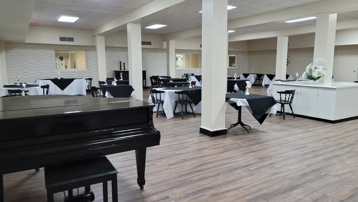 Interior dining area with tables and piano
