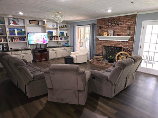 Cozy common area with seating and a fireplace