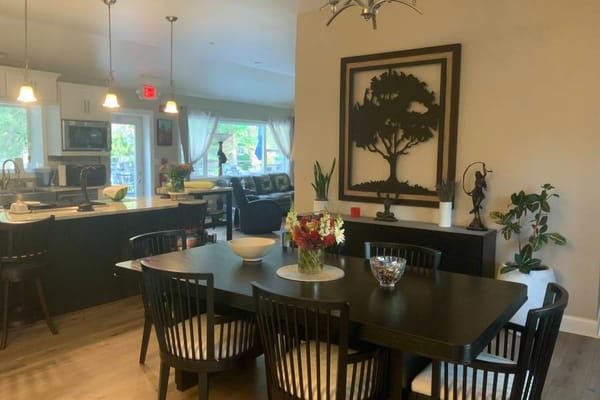 Bright dining area with a large table and decor