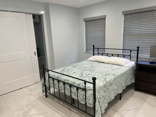 Private resident room with a bed and dresser