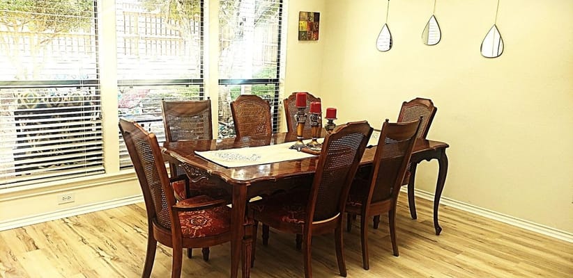 Elegant dining room setup with wooden table and chairs