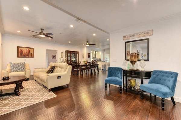 Bright common area with seating and dining table