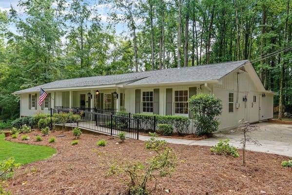 Exterior view of Harris Senior Living Home surrounded by trees