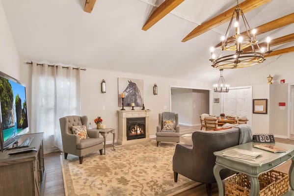 Common area with comfortable seating and a fireplace