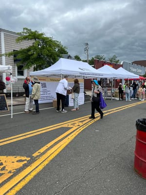 Residents and staff interacting at an outdoor event