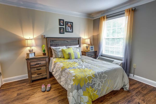 Cozy private bedroom with floral bedding and decor