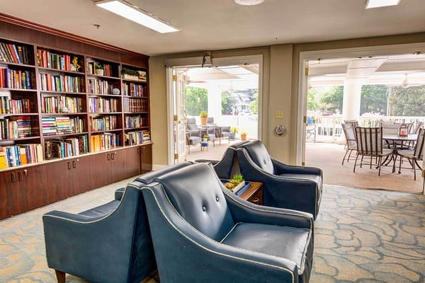 Cozy common area with seating and bookshelves