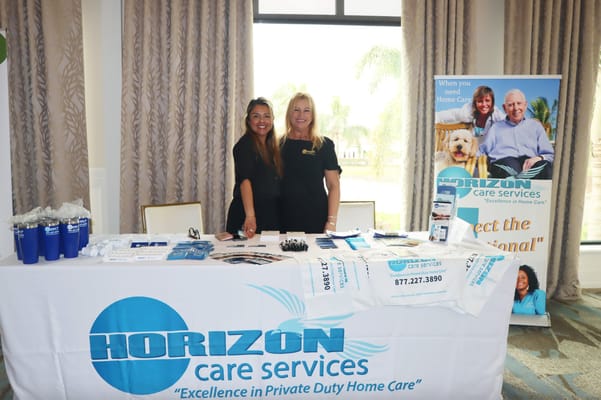 Staff at a promotional table for Horizon Care Services