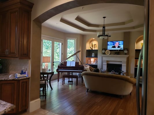 Interior view of a cozy common area with piano
