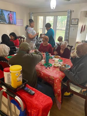Residents enjoying a meal together in a communal dining area