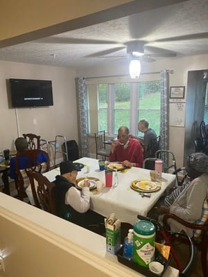 Residents enjoying a meal in a common area