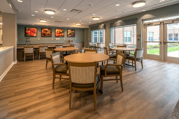 Bright dining area with tables and chairs