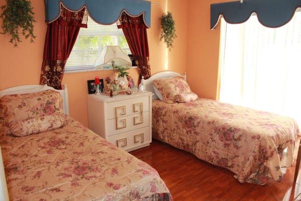 Cozy bedroom with twin beds and floral decor
