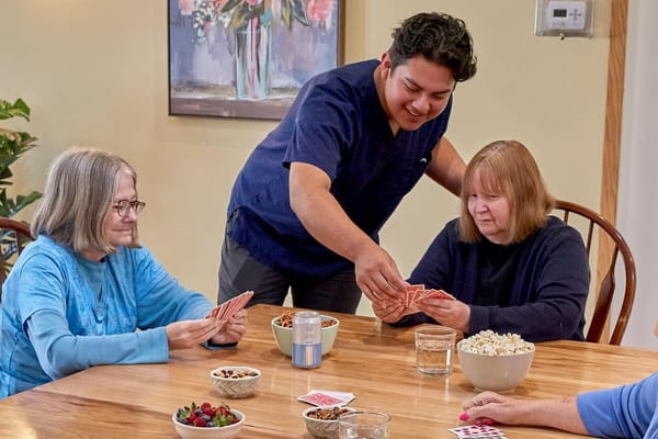 Residents playing cards in a common area