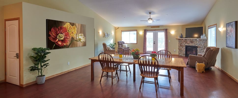 Bright common area with seating and table