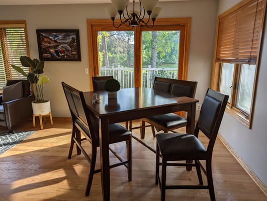 Bright dining area with a table and chairs