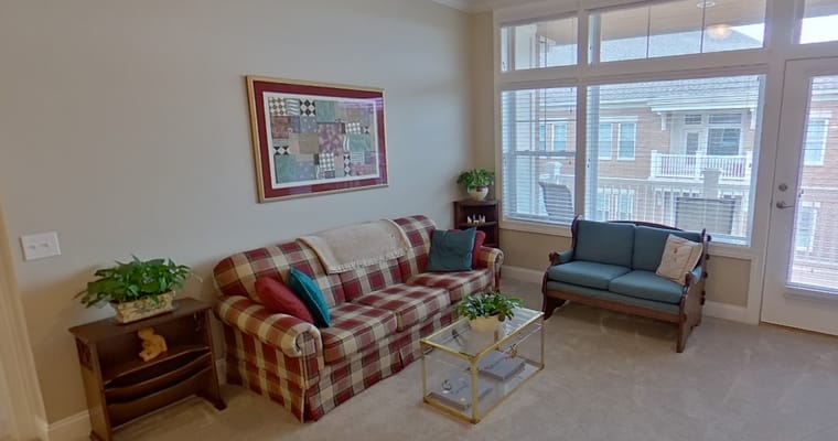 Cozy sitting area with comfortable furniture and plants