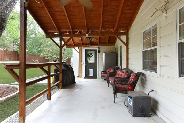 Covered porch area with seating