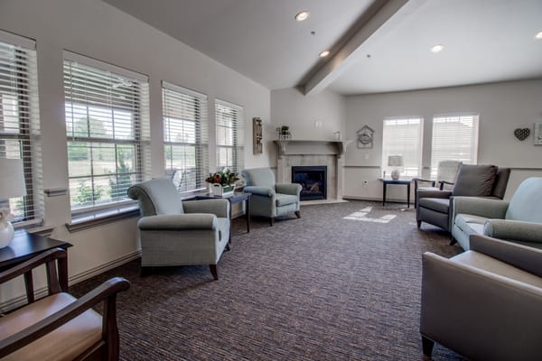 Bright common area with comfortable seating and natural light
