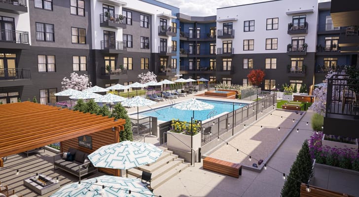 Outdoor pool area with seating and umbrellas