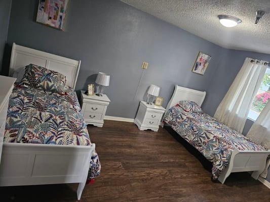 Cozy shared resident room with two beds and nightstands