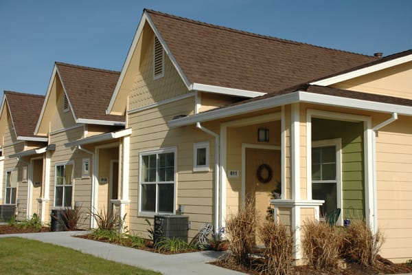 Exterior view of small residential buildings in a community setting