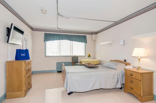 Clean and simple resident room interior with furniture