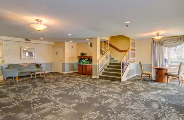 Common area with seating and stairs in the facility