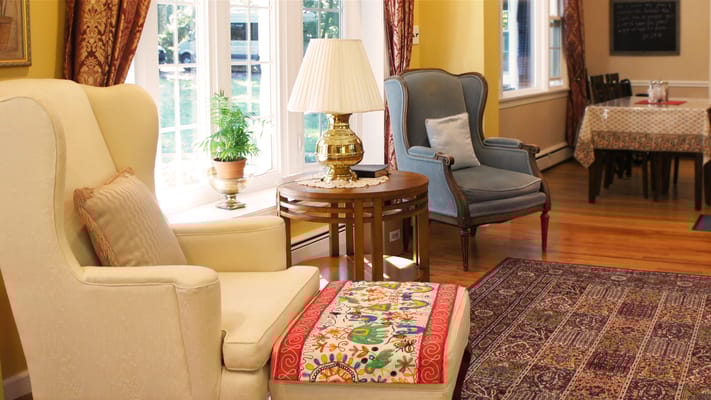 Warm living room with seating area and decorative accents