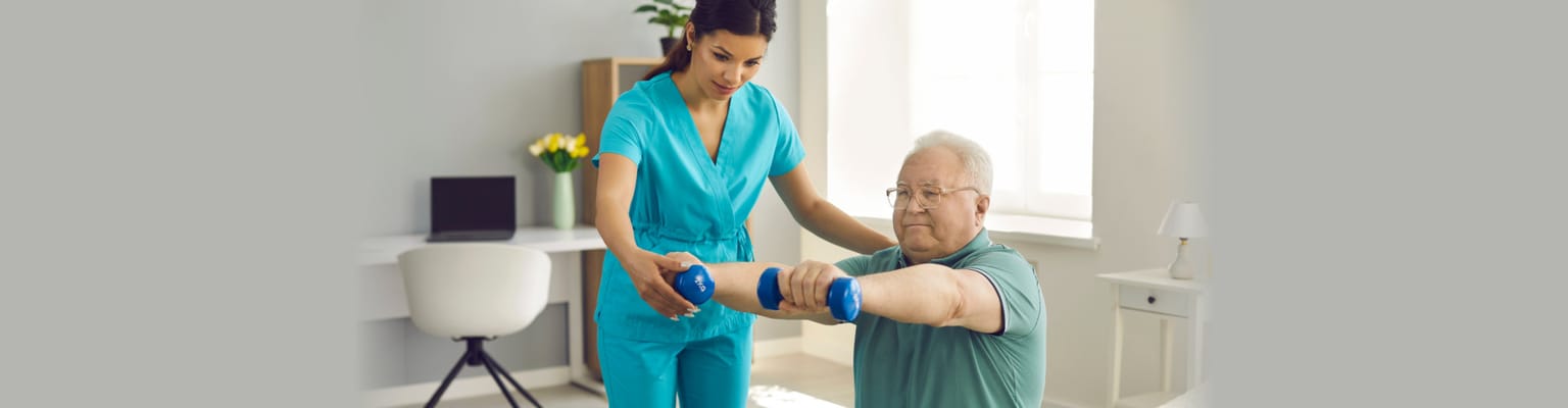 Caregiver assisting a senior with exercise