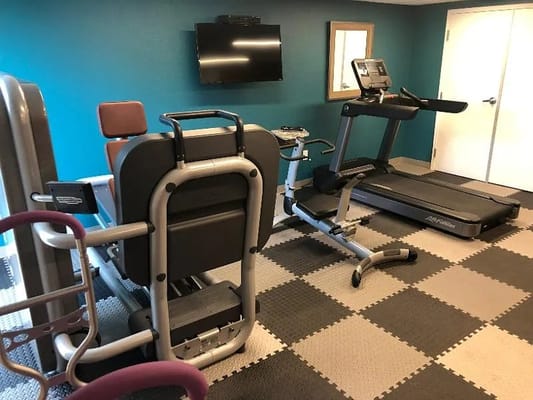 Interior view of a fitness room with exercise equipment