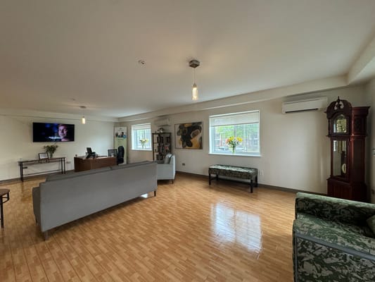 Common area with seating and a television