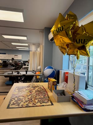 Interior of activity room with puzzle and balloons