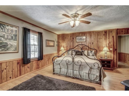 Cozy bedroom with wooden accents and decorative lamps