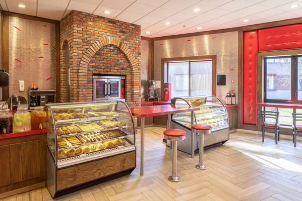 Brightly decorated common area with baked goods display