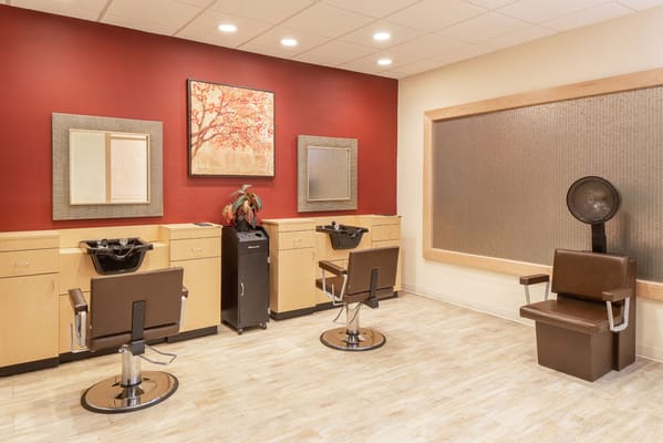 Interior view of a salon area with styling chairs