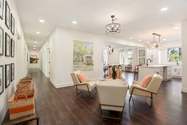 Bright interior common area with seating and artwork