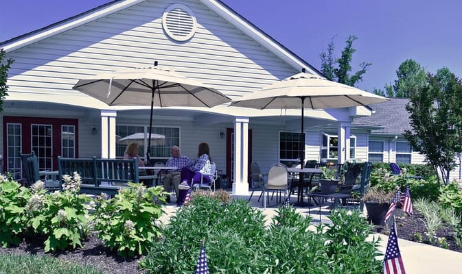 Residents enjoying time in a shaded outdoor area