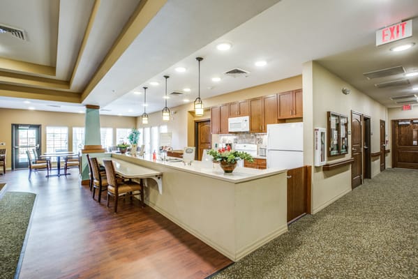 Interior view of a communal space with kitchen area
