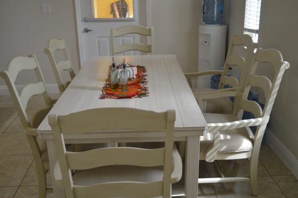 Dining area with a large table and chairs.